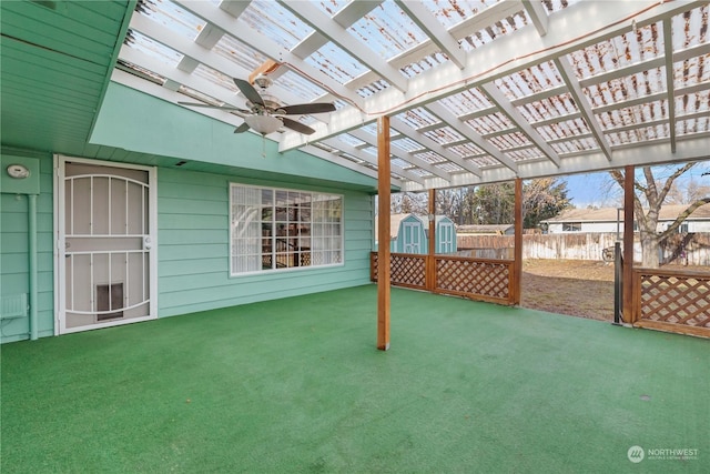 view of patio featuring a storage unit and a pergola