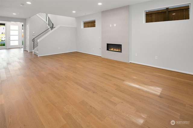 unfurnished living room featuring light hardwood / wood-style flooring