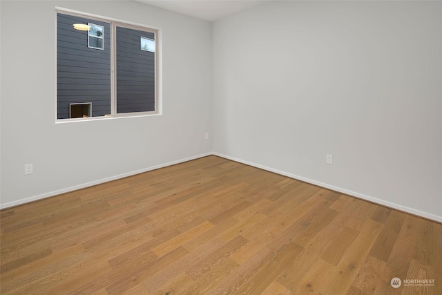 unfurnished room with light hardwood / wood-style flooring