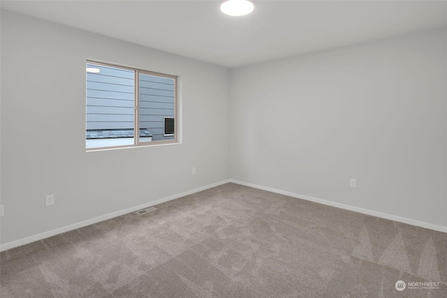 empty room featuring carpet flooring