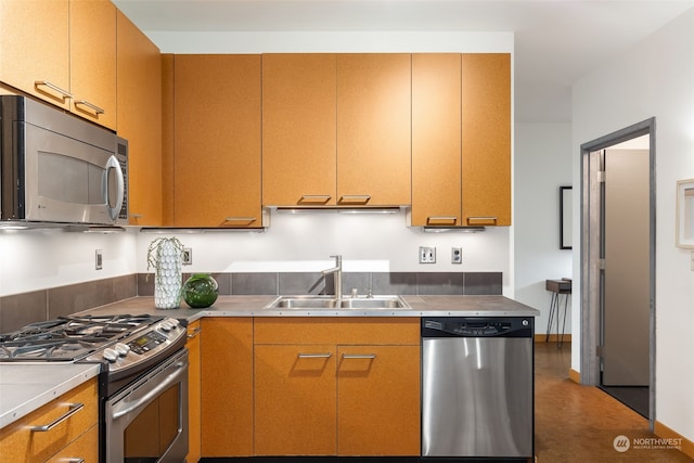 kitchen featuring sink, stainless steel counters, and appliances with stainless steel finishes