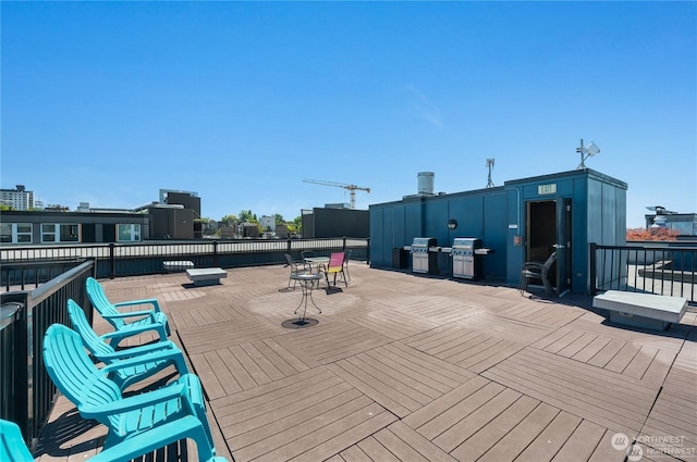 wooden deck with a grill