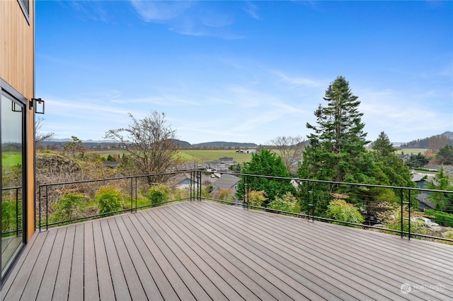 wooden terrace featuring a mountain view