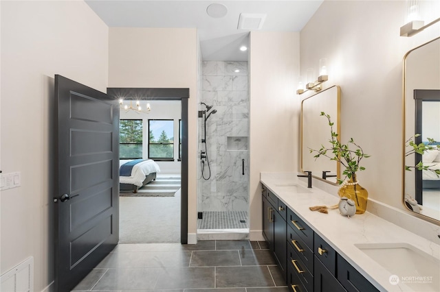 bathroom featuring vanity and a shower with shower door