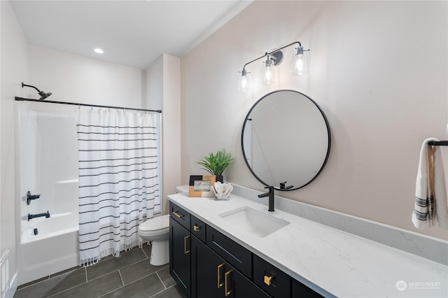 full bathroom featuring toilet, tile patterned floors, vanity, and shower / tub combo with curtain