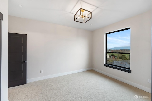 unfurnished room with light colored carpet