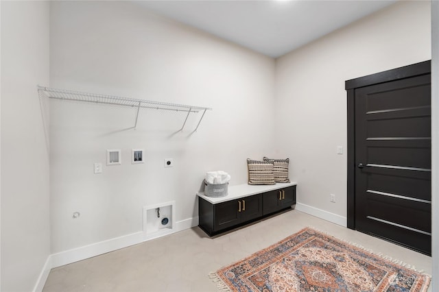 clothes washing area with hookup for a washing machine, hookup for a gas dryer, and electric dryer hookup