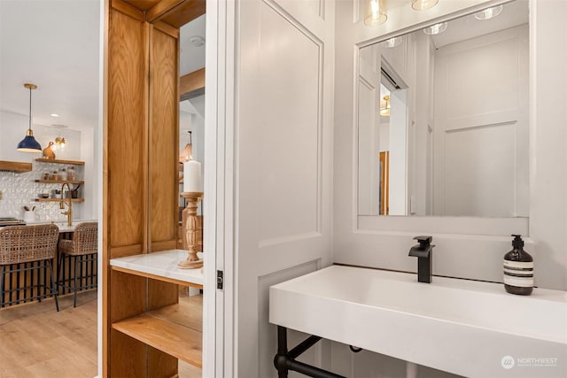 bathroom featuring sink and hardwood / wood-style floors