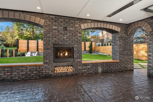 view of patio featuring an outdoor fireplace