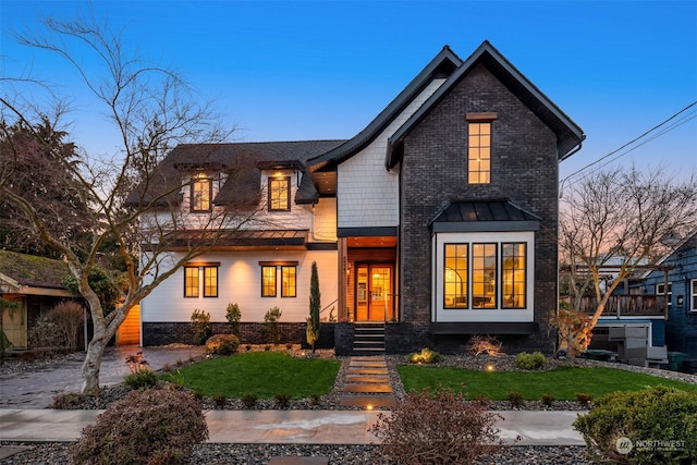 view of front of house with a lawn