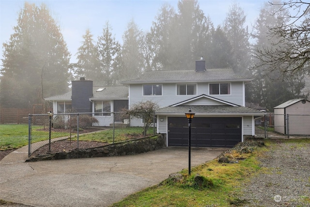 view of front of house with a front yard and a garage