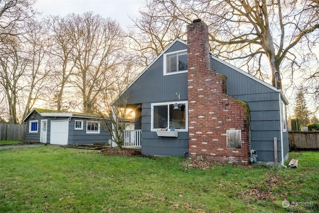 rear view of property with a yard