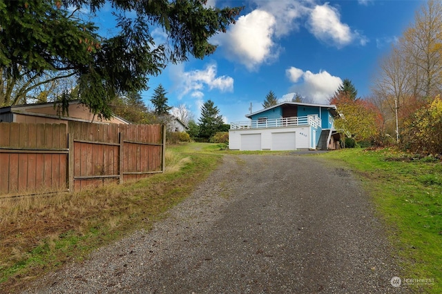 view of side of home with a garage