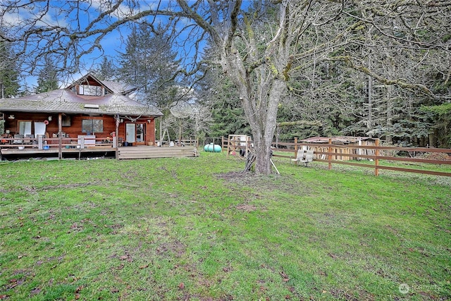 view of yard with a wooden deck