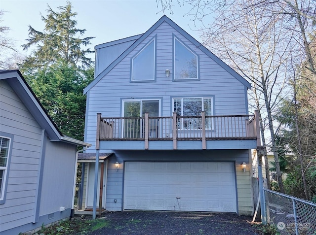 view of front of house featuring a garage and a balcony