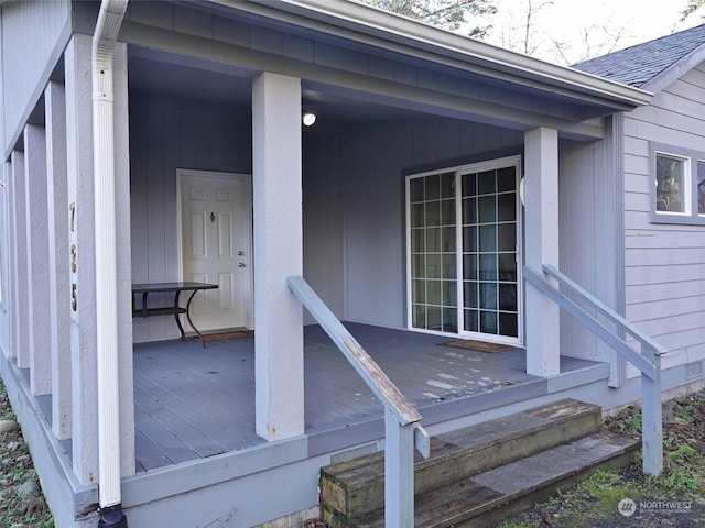 entrance to property with a wooden deck