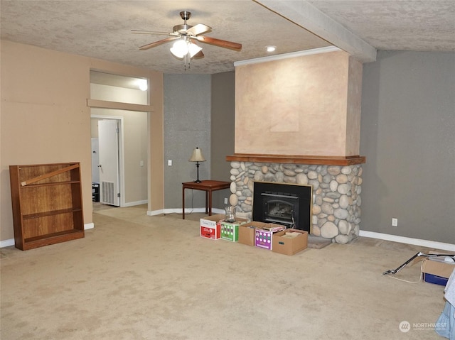 living room with ceiling fan, a textured ceiling, and carpet flooring