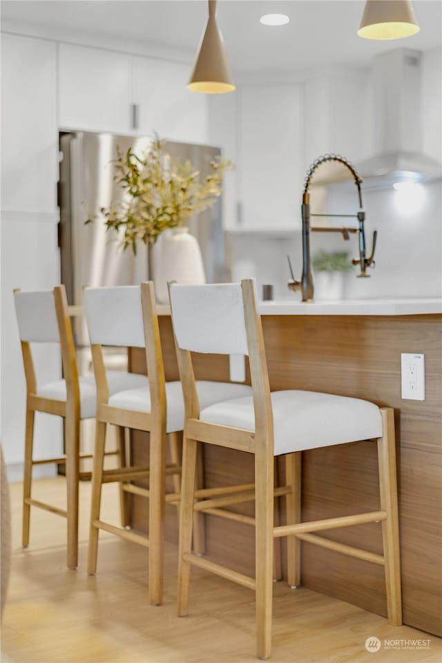 dining area featuring light hardwood / wood-style floors and sink