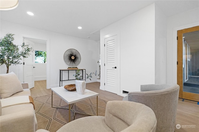 living room with light hardwood / wood-style floors