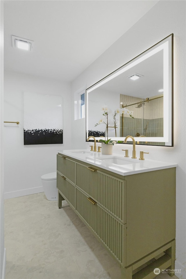 bathroom featuring a shower, vanity, and toilet