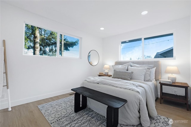 bedroom with light hardwood / wood-style floors