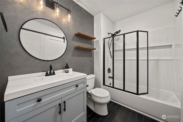 full bathroom featuring toilet, enclosed tub / shower combo, and vanity