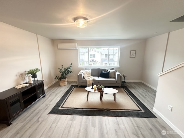 living room with a wall mounted air conditioner and light wood-type flooring