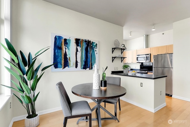 dining area featuring light hardwood / wood-style floors