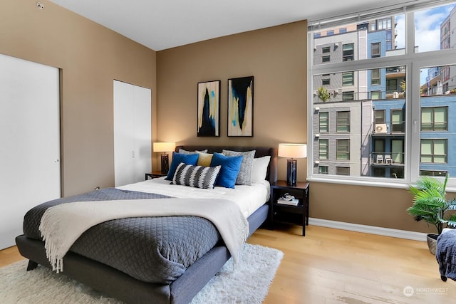 bedroom with light hardwood / wood-style floors