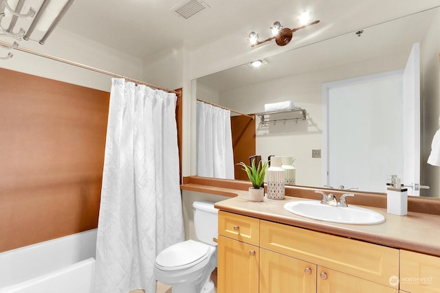 full bathroom featuring shower / bath combination with curtain, vanity, and toilet