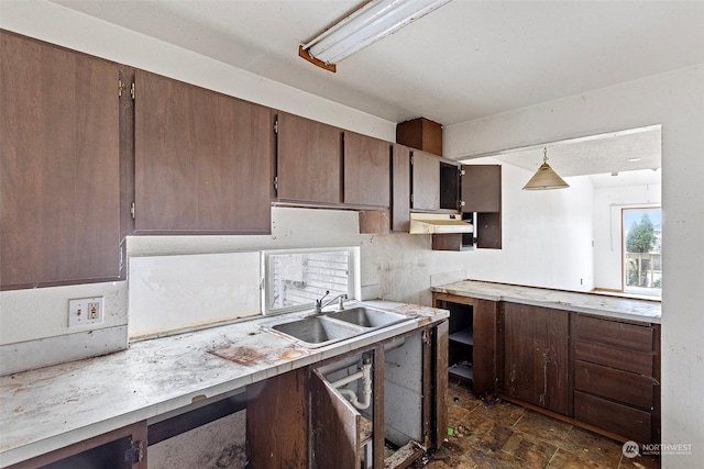 kitchen featuring sink and hanging light fixtures