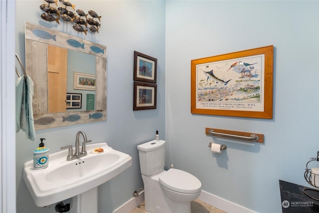 bathroom featuring sink and toilet