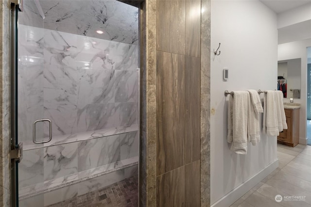 bathroom featuring a shower with shower door