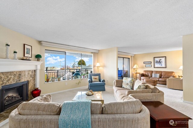 living room featuring carpet floors and a textured ceiling