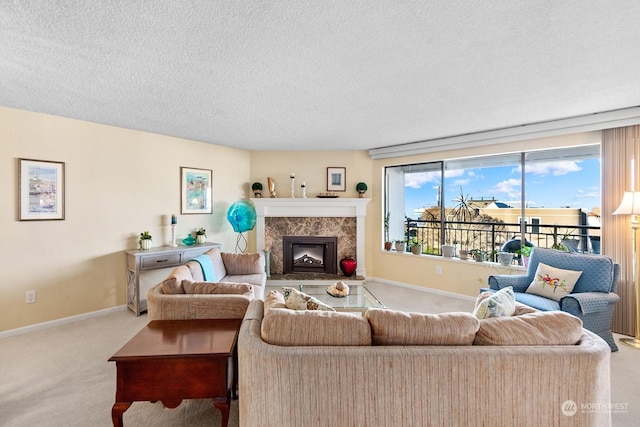 living room featuring a textured ceiling, light carpet, and a high end fireplace