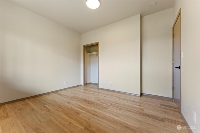 spare room featuring light wood-type flooring