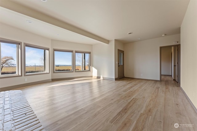 empty room with light hardwood / wood-style floors