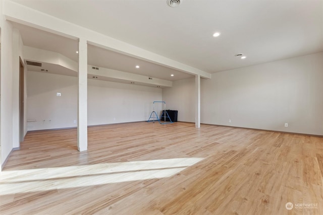 basement featuring light hardwood / wood-style floors