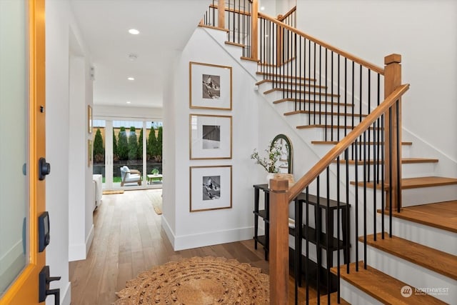 entryway with wood-type flooring