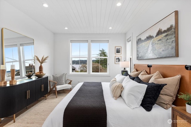 bedroom featuring wooden ceiling and light hardwood / wood-style floors