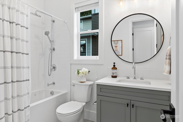 full bathroom with vanity, toilet, and shower / bath combo with shower curtain