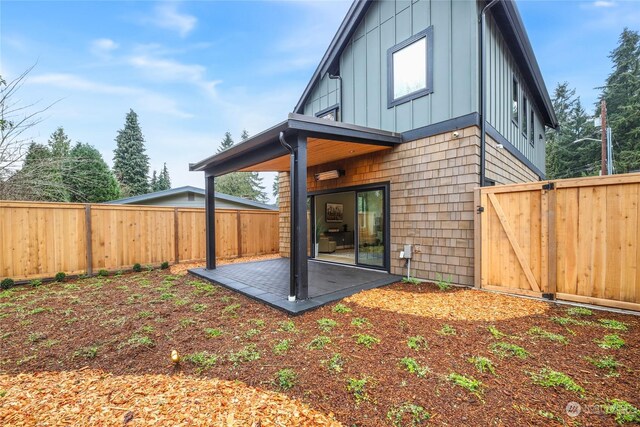 rear view of house with a patio