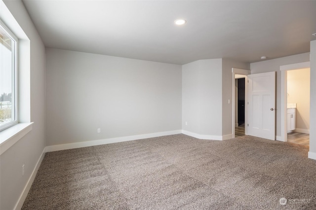 unfurnished room with carpet