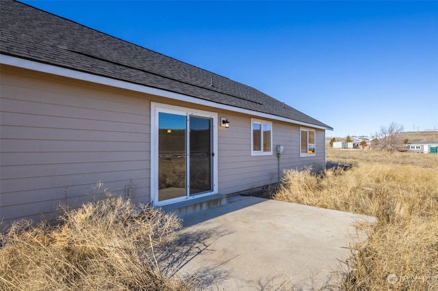 back of property with a patio