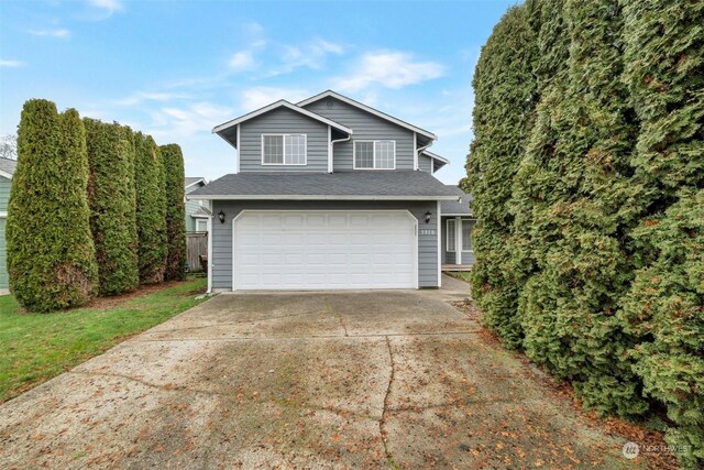 front of property with a garage