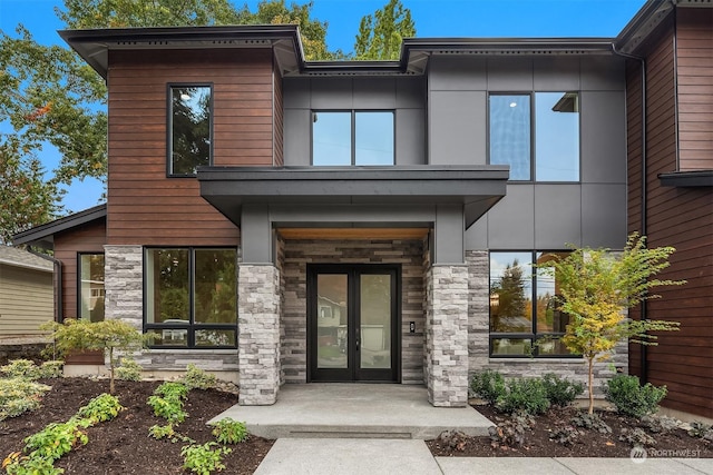 property entrance featuring french doors