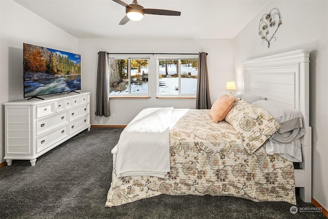 bedroom featuring ceiling fan and dark carpet