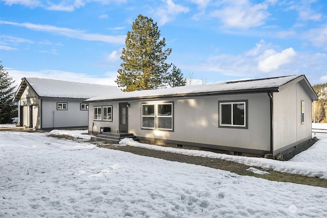 single story home featuring a garage