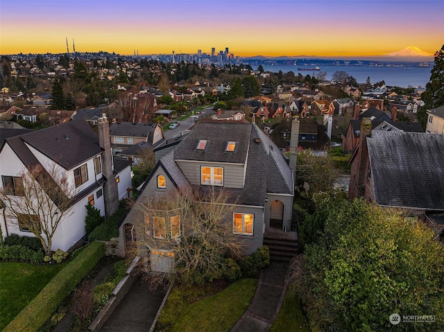 aerial view at dusk with a water view