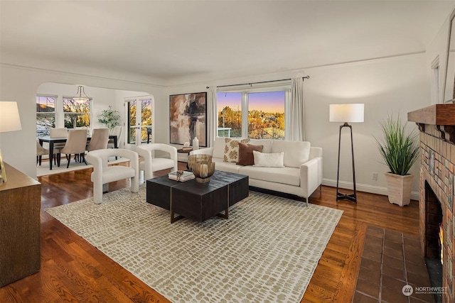 living room with a fireplace and dark hardwood / wood-style floors